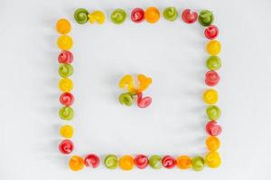 Multicolored pasta in the shape of a square on a white background photo