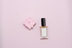 Perfumes bottle with pink present box, mokeup photo