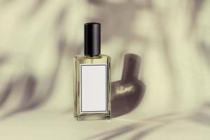 Glass perfume bottle with shadowed background, mokeup photo