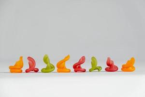 Multicolored pasta lie in line on a white background photo