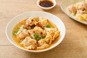 pork wonton soup or pork dumplings soup with roasted chili photo