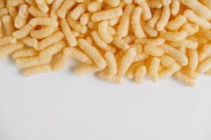 Corn sticks scattered on a white background. Top view. Place for your text photo