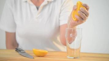 Squeezing Orange Juice into a Glass video