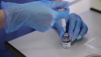 The Surgeon prepares a Syringe and a Needle for Injections of Botox video