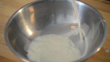 Preparation of the Dough. Egg Falls On A Pile Of Sugar video