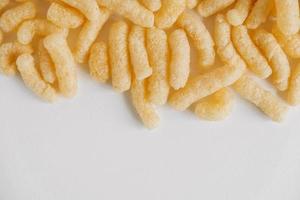 Corn sticks on a white background. Top view. Place for your text photo