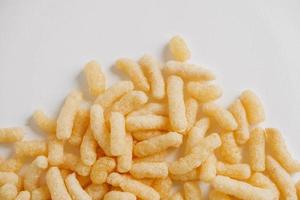 Corn sticks scattered on a white background. Top view. Place for your text photo
