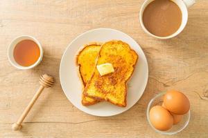 French toasted with butter and honey photo