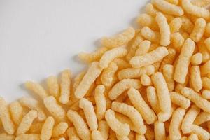 Corn sticks on a white background. Top view. Place for your text photo