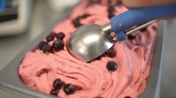 Close Up Berries Ice Cream Scooping Out Of Container
