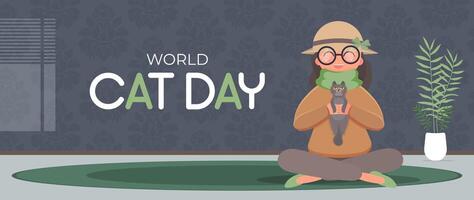 World cat day banner. The girl sits in the lotus position and holds the cat in her arms. Funny and beautiful poster. Cartoon style. Vector illustration.