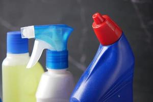 close up of cleaning bottle on table photo