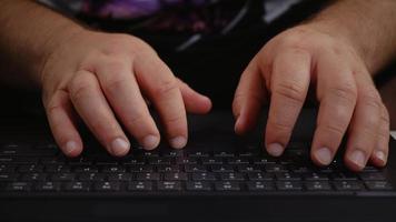 Man hands typing on laptop keyboard. video