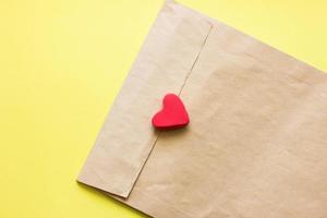 love letter in a craft envelope with a sealing heart. copy space for text. photo