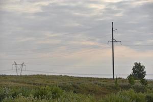 High voltage power line in the steppe field photo