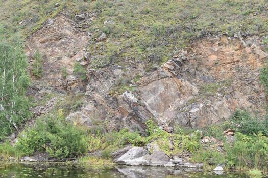 River and mountain with trees in the steppe field photo