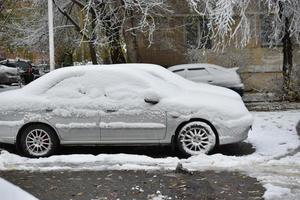 Cars in the winter in the snow after a snowfall photo