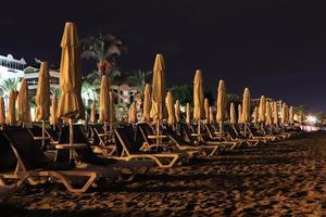 Closed beach umbrellas. Night long exposure. Alanya. Turkey. photo