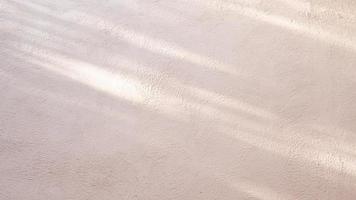 Abstract background from stucco concrete wall with sunlight, light and shadow photo