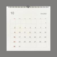 October 2022 calendar page on white background. Calendar background for reminder, business planning, appointment meeting and event. photo