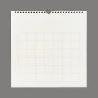 White calendar paper background with grid line of table. Wall calendar on gray background. photo
