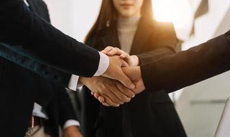 Close up on hands of business people join together their hands together on unity concept photo