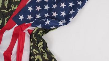 American flag and Military camouflage pattern. Top view angle. photo