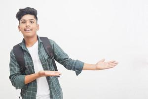 Young Indian college boy Showing Direction With Hand photo