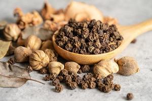 black pepper and siam cardamom Amomum krervanh Pierre, Asia dried spices herb for drug and Thai cooking for good health. photo