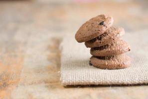 Chocolate cookies on linen fabric photo