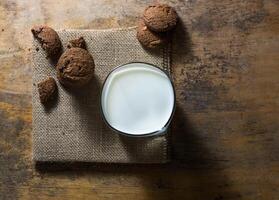 top view of sweet chocolate cookies and milk photo