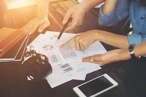 Close-up shot of an analytical team working with the latest financial results, Office life concept. photo