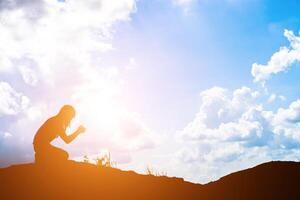 Sad woman sitting alone. photo