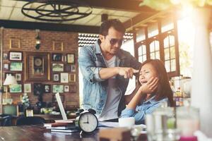 Boss shouting to a stressed employee when she work with laptop at office, talking about not complete by work, Business fail concept. photo