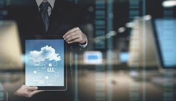 Double exposure of Businessman hand working with a Cloud Computing diagram on the new computer interface as concept photo