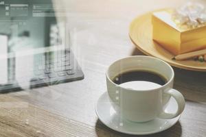 Coffee cup and Digital table dock smart keyboard,gold gift box and round wood tray,color pencil on wooden table,filter effect photo