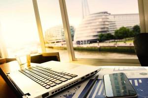 business documents on office table with smart phone and digital tablet as work space business with social network diagram concept photo