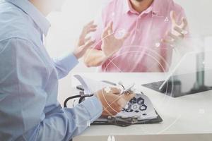 Medical doctor using mobile phone and consulting businessman patient having exam as Hospital professionalism concept photo