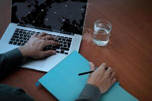 top view of Double exposure of businessman hand working with new modern computer and business strategy as concept photo