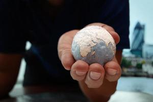 close up of businessman hand showing texture the world photo