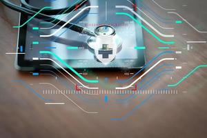 Studio macro of a stethoscope and digital tablet with shallow DOF evenly matched abstract on wood table background copy space photo