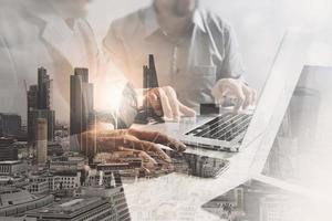 Double exposure of success businessman working in office with digital tablet laptop computer with London building and smart phone,filter effect photo