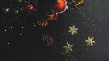 Greeting Season concept.hand setting of ornaments on a Christmas tree with decorative light photo