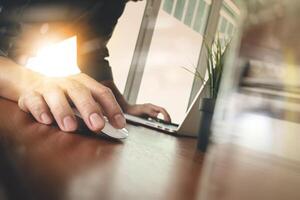 businessman hand working with modern technology and glass of water as business strategy concept photo