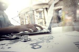 Doctor working with digital tablet and laptop computer in medical workspace office and medical network media diagram as concept photo