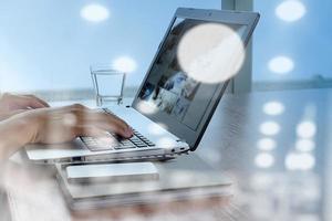 double exposure of business documents on office table with smart phone and digital tablet and stylus and two colleagues discussing data in the background photo