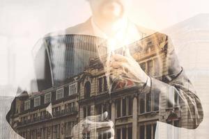 Double exposure of success businessman holding neck tie with London building,Bigben,front view,filter effect photo