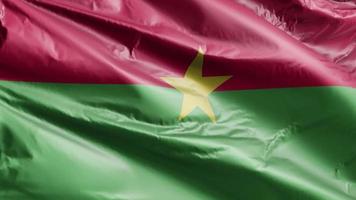 Burkina Faso flag slow waving on the wind loop. Burkina Faso banner smoothly swaying on the breeze. Full filling background. 20 seconds loop. video