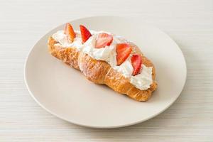 strawberry fresh cream croissant on plate photo