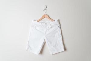 short pants hanging on wall photo